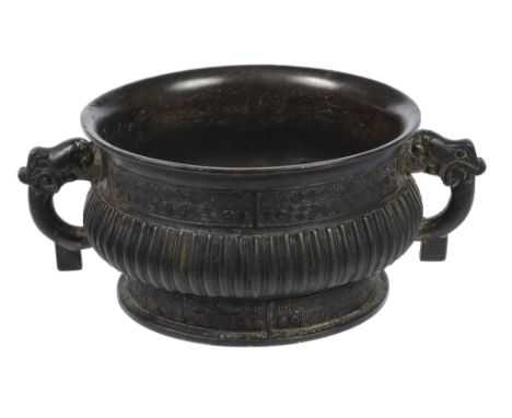  A Chinese bronze gui vessel  , with ribbed body enclosed within geometric bands, 19cm diam Provenance: From the private coll