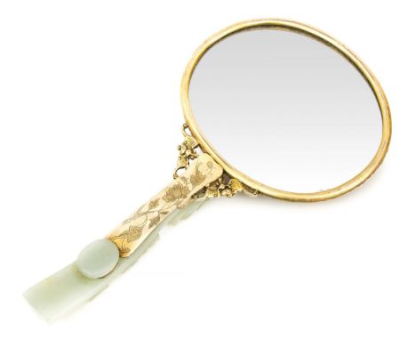  A gilded metal mounted jade mirror, 19th century  , the celadon jade dragon belt- hook forming the handle and a rectangular 