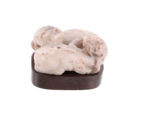  A pale celadon and brown jade Qilin group,    the two creatures recumbent and facing to the left and right,    5cm long, woo