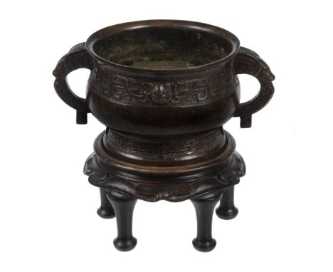  A bronze archaic style two- handled censer, Gui  , the upper band with long-tailed birds reserved on a leiwen ground, interr