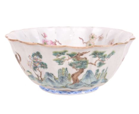  A Chinese  famille rose   fluted bowl, 19th century,   the exterior painted with a dragon and a tiger, the interior with a b