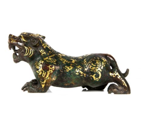 A bronze model of a tiger, Warring States-Western Han style, powerfully cast, prowling forward with raised head, quasi-triang