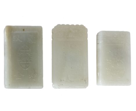  Three pale celadon jade plaques   of rectangular shape carved, respectively, with an immortal figure, bats and butterflies h