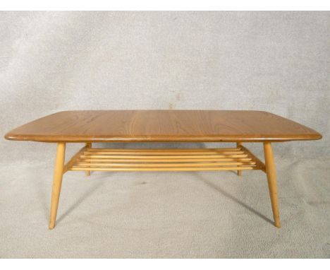 A mid century blonde elm and beech Ercol Windsor coffee table, model 459 with maker's label to the underside. H.36 L.104 D.43