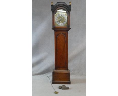 A Georgian mahogany cased longcase clock with urn form brass finials, the eight day movement by Thomas Church of Norwich with