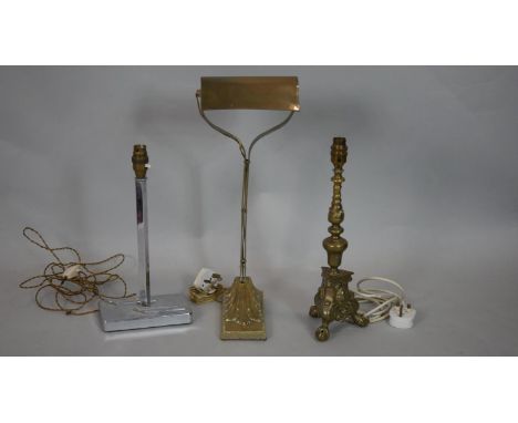 A vintage brass banker's desk lamp on scroll base, an Art Deco lamp base and a brass ecclesiastic style lamp base. H.49cm (Ta