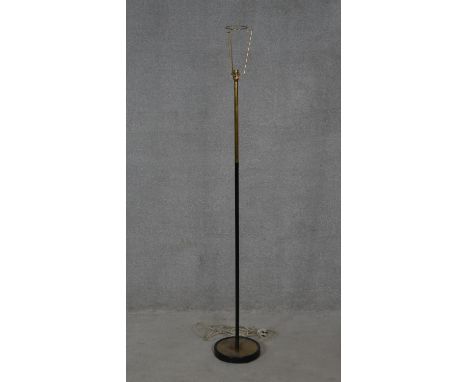 A vintage brass and tubular metal standard lamp. H.145cm 
