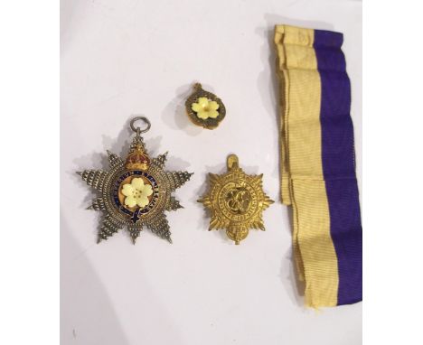A Primrose League medal and lapel button together with a Royal Army Service Corps badge Condition Report:Available upon reque