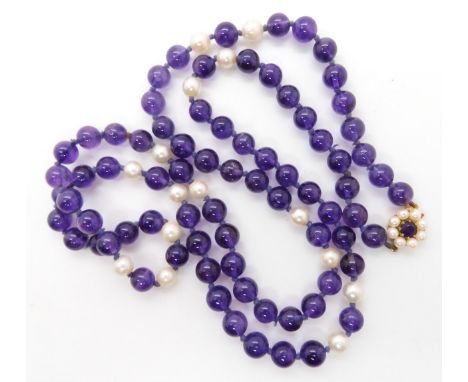 A string of amethyst beads and pearls with a 9ct gold amethyst and pearl clasp Condition Report:Not available for this lot.