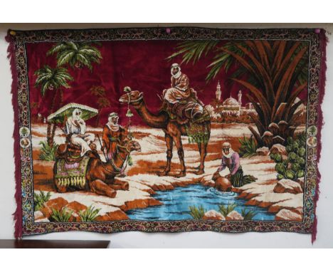 A 20th century tapestry depicting camels at an oasis, 118cm high x 173cm wide&nbsp; Condition Report:Available upon request