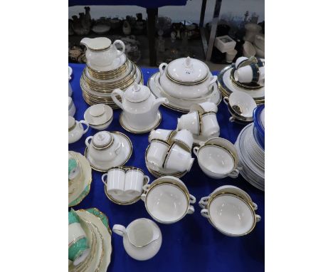 A Royal Doulton Pavanne dinner service comprising plates, tureen, platter, cups and saucers etc and a Platinum Concorde teapo