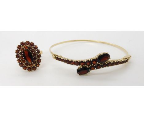 A 9ct gold garnet cluster ring with matching bangle. Ring size P1/2, weight combined 12.5gms Condition Report:Available upon 