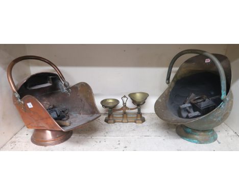 A copper coal scuttle, together with another brass example, a set of weighing scales and associated weights Condition Report: