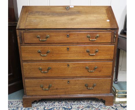A C19th mahogany bureau, the writing surface inset with a green baize skiver, the whole raised on bracket feet, 104 x 96 x 53