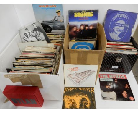 A collection of 45 RPM 7" vinyl records with Sex Pistols, Scheme, The Doors, The Rolling Stones, The Cult, Human League, UB40