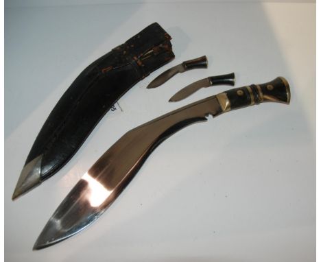 A kukri in leather scabbard Condition Report:Available upon request