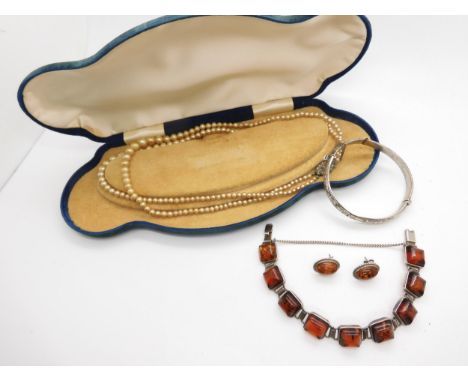 A white metal mounted bracelet set with amber, silver amber earrings and a silver bangle and faux pearls both (af) Condition 