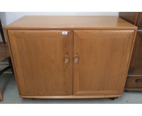 A contemporary elm and beech ercol two door media cabinet, 79cm high x 104cm wide x 57cm deep&nbsp; Condition Report:Availabl