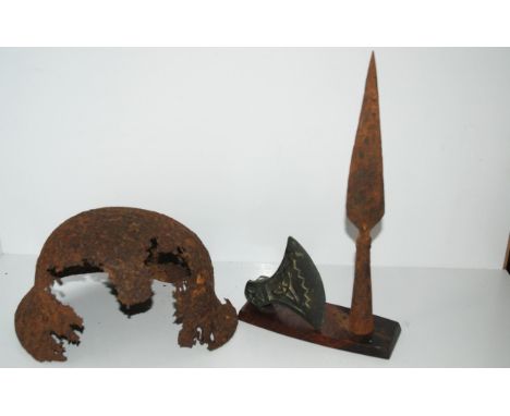 An African spear tip, Celtic axe head and German military helmet (af) Condition Report:Available upon request