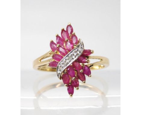 A 9ct gold ruby and diamond accent cluster ring, size p1/2, weight 2.2gms Condition Report:Available upon request