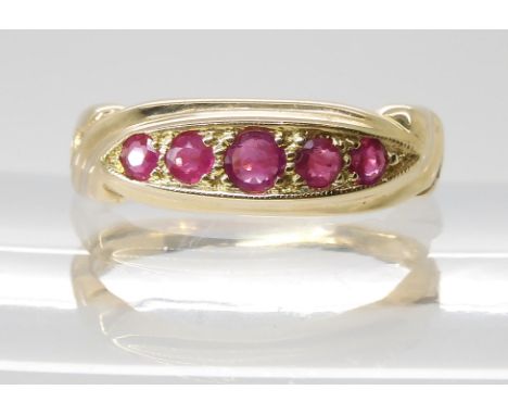 A 9ct gold five ruby ring, size M1/2, weight 3gms Condition Report:Available upon request