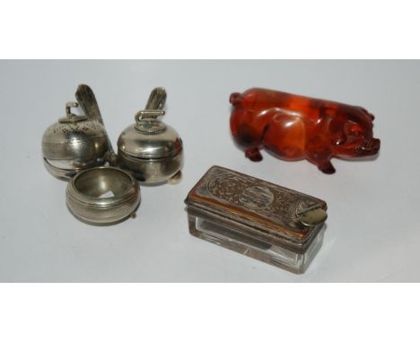 A novelty white-metal condiment modelled as curling stones, ink pot, model pig Condition Report:Available upon request