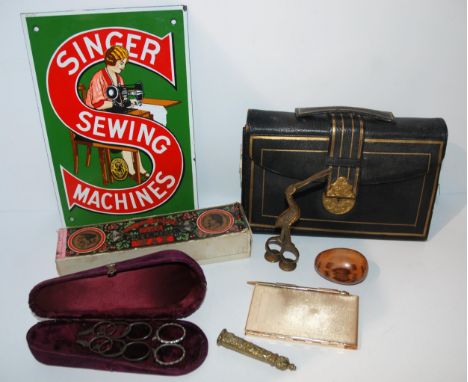 A tray lot including ribbon/umbilical scissors modelled as a stork, Singer modern enamel sign, cases, vintage scissors etc Co
