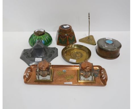 A wooden penwork inkwell decorated with flowers, an Austrian lustre glass inkwell, a Gesetzl Geschutzt metal inkwell, a coppe