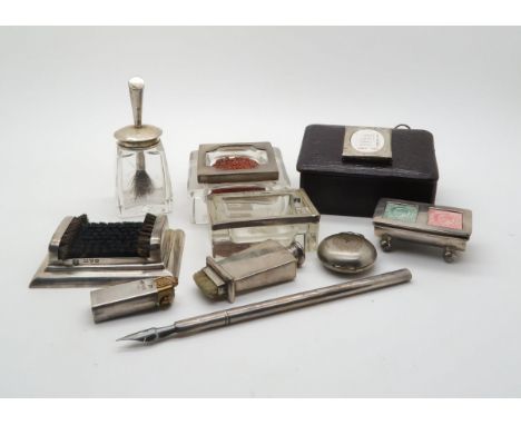 A collection of silver stamp related ephemera, including a silver topped glass stamp roller by&nbsp;Claydon Robin &amp; Co, B