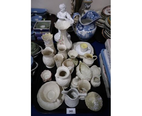 A collection of Belleek porcelain of assorted ages including vases, jugs, cups and saucers etc Condition Report:Not available