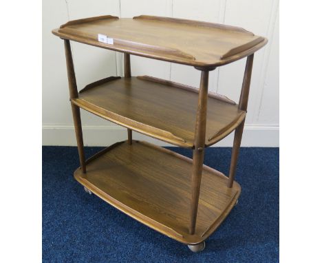 A mid 20th century elm and beech Ercol three tier trolley model 458, 77cm high x 72cm wide x 46cm deep Condition Report:Avail