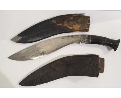 A Kukri in scabbard and another kukri scabbard (af) Condition Report:Available upon request