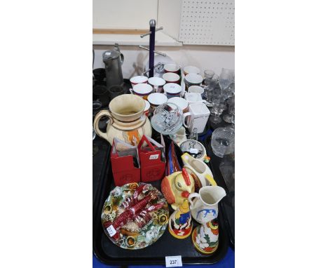 A Portuguese lobster dish, a Wedgwood Clarice Cliff sugar shaker, a Moorland sugar shaker and jug, a Clarice Cliff Celtic Har