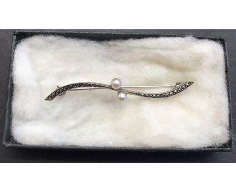A silver and pearl brooch, total weight approx. 3.2 grams, marcasite with cultured pearl