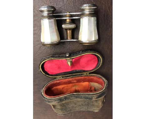Mother of pearl opera glasses in leather pouch, there is a crack to one of the lenses. Some wear 