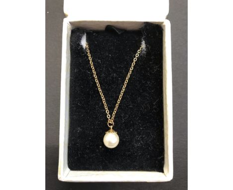 A yellow metal necklace with simulated pearl drop 