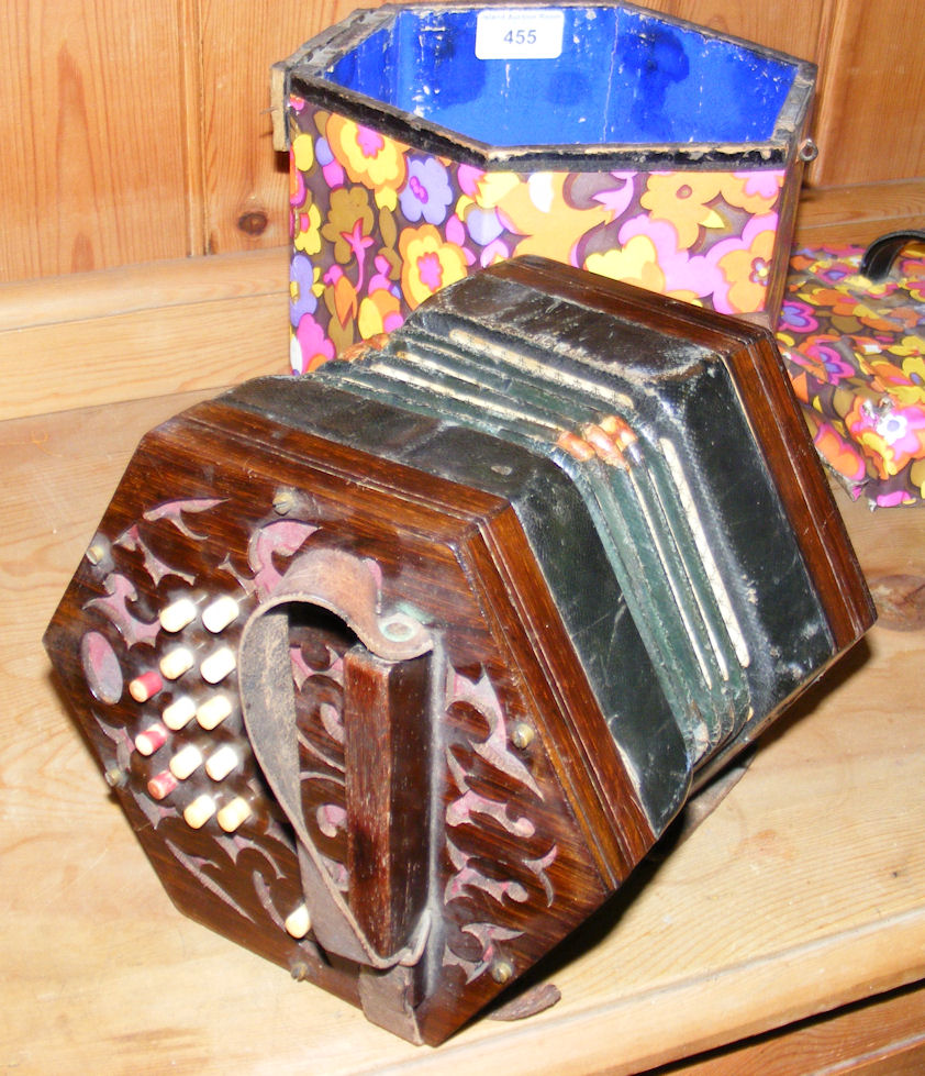 An antique squeezebox with original case