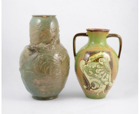 A large Bretby Art Pottery Dragon vase, late 19th Century, modelled in relief with an Asian Dragon to the swollen shoulder, a