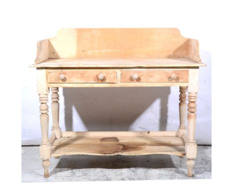 Vintage pine washstand, three quarter gallery back, two drawers, open potboard shelf, width 105cm, depth 49cm, height 93cm.