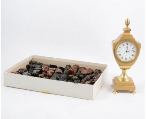 A moonstone and onyx chess set and board, another chess set in a leather case, and a brass mantel clock (3)