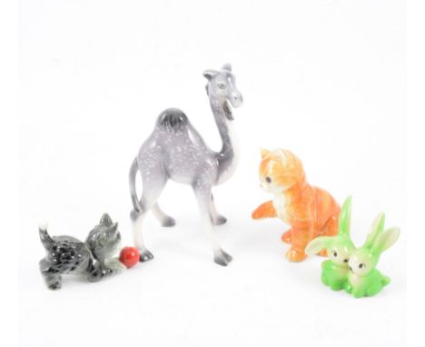 Seven Goebel figures, including Ginger Kitten, Camel, Piglet, pair of green rabbits, puppy group, and others. (7)