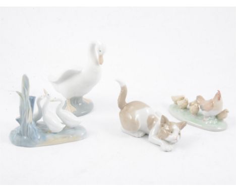 One Lladro cat and eight Nao animal and bird figures, including kitten, puppy, doves, geese, hen and chicks (9)