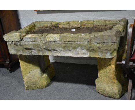 Old stone trough, rectangular form, later concrete rim, 10cm x 55cm.