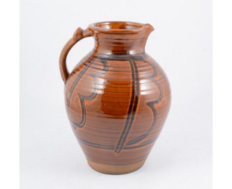 A large studio pottery pitcher, ribbed body with panelled design, 31cm high.