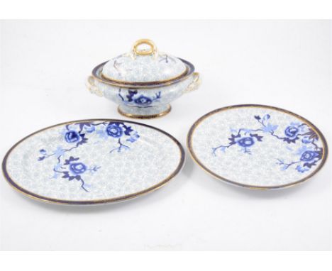 A large Royal Worcester dinner service, blue transfer decorated with branches of peony flowers against a ground printed with 