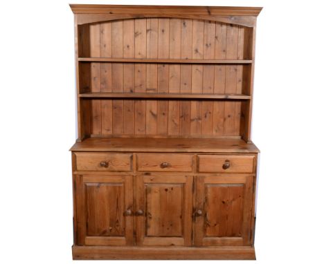 Modern pine dresser, with two shelf delft rack, above three short drawers and three panelled cupboards, width 137cm, depth 42