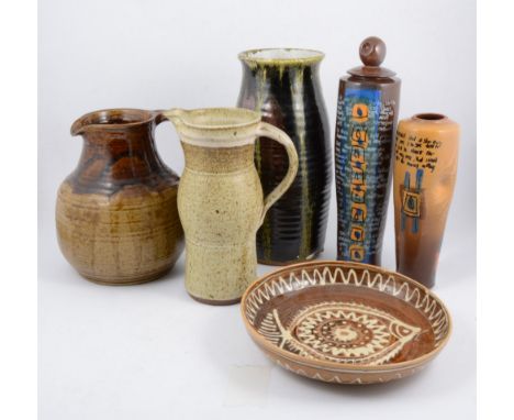 A collection of studio pottery/ slipware, including an oatmeal glazed pitcher, a large stoneware jug, large vase with streake