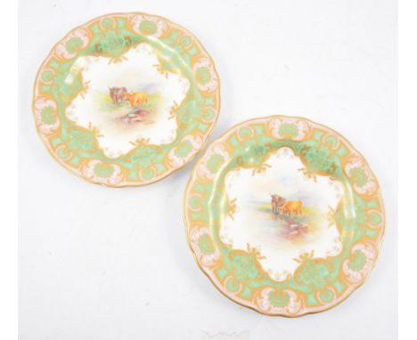 Two Royal Worcester cabinet plates decorated by E. Townsend, late 20th Century, painted with Highland cattle in a mountainous
