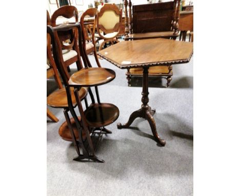 George III style mahogany pedestal table, hexagonal top, fluted column, carved tripod legs, width 50 cm; and folding cake sta