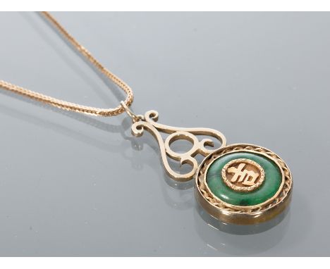 CHINESE JADE PENDANT
with a central Chinese symbol, surrounded by a ring of green jade, marked '20' to the reverse, on a nine